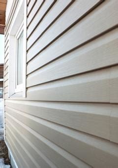 The top of the piece of siding is beveled so that the bottom half of the siding stands out. Vinyl Siding Styles | LoveToKnow