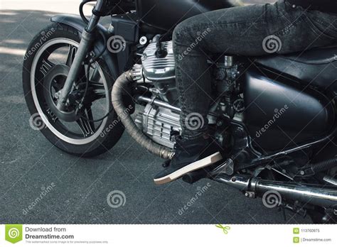 Mounted Black Vintage 1980s Custom Motorcycle On Pavement Stock Image