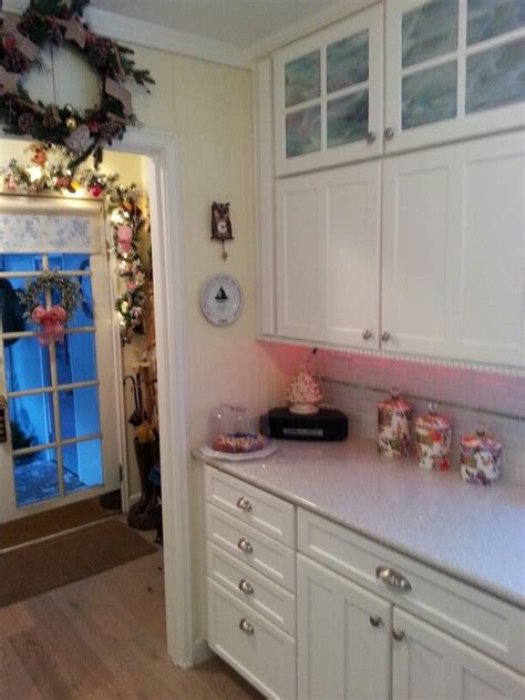 Kitchen cabinets with this sort of glass cabinet fronts don't usually show stains, marks and fingerprints. .My kitchen ..The opal stained glass in the upper cabinets ...