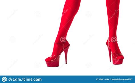 Female Legs In Fetish Red Stockings And Red High Heels Isolated On White Show Girls And Night