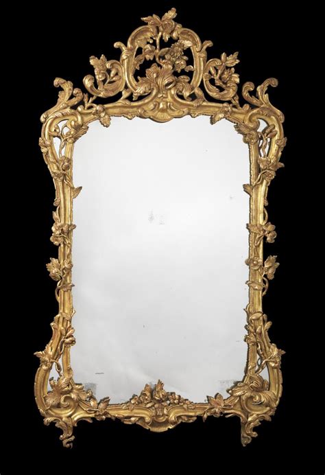 A Louis Xv Carved Giltwood Mirror Bada