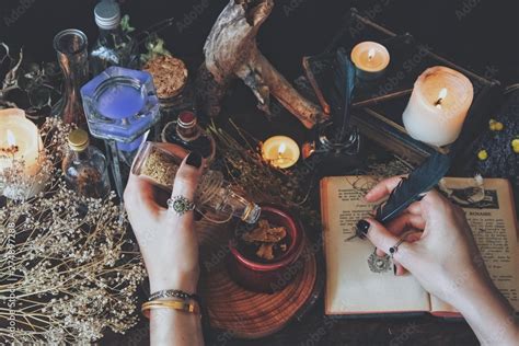 A Witch Casting A Spell And Writing It Down In Her Book Of Shadows With