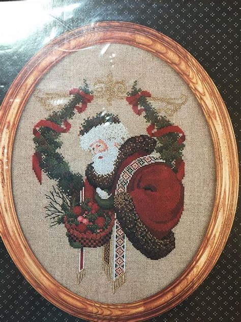 The search of embroidery patterns, cross. Santa Claus Gift of Peace Cross Stitch Pattern Lavender ...