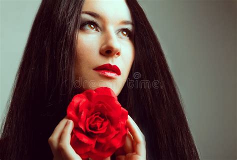 Close Up Portrait Of Beautiful Brunette Woman With Red Rose Stock Image