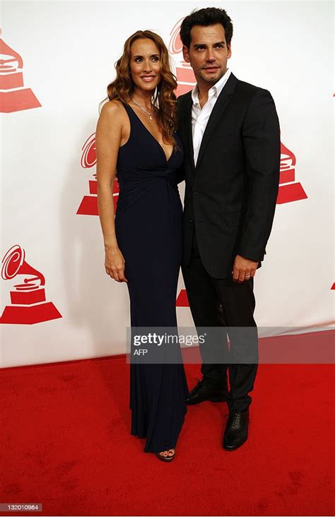 Christian De La Fuente And His Wife Arrive At The 2011 Latin News