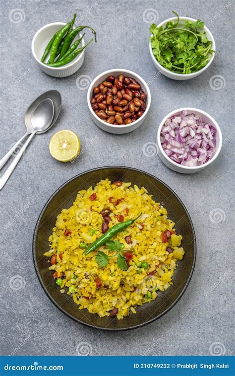 Spicy Indian Snack Or Breakfast Poha With Onion And Peanuts Stock Photo