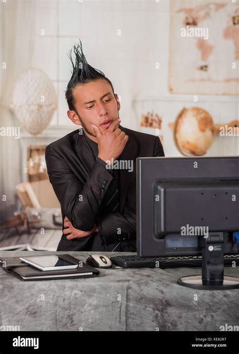 Close Up Of Thoughtful Office Punk Worker Wearing A Suit With A Crest