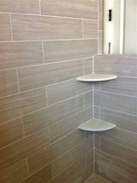 Alabaster Corner Shelves In Shower With 6x24 Porcelain Tile On Walls