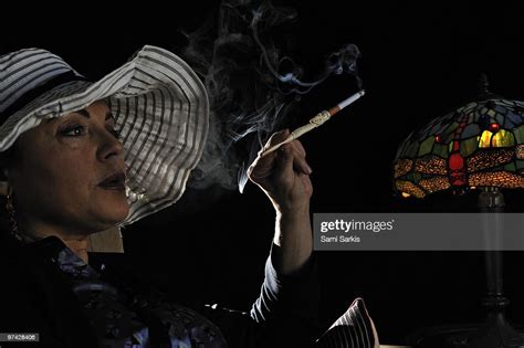 Mature Woman Smoking With Cigarette Holder High Res Stock Photo Getty