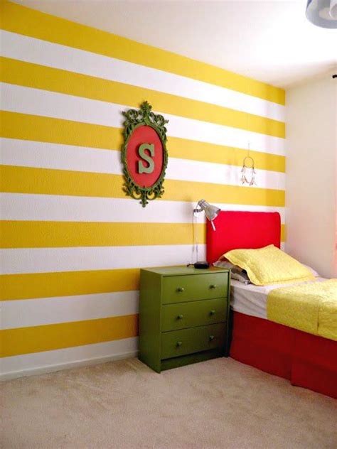 Colorful Kids Room With Yellow Stripes Wall And Yellow And Red Accents
