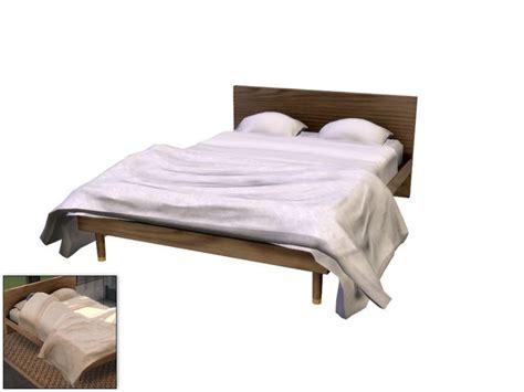A Modern Wooden Platform Bed Featuring White Linens And A Throw