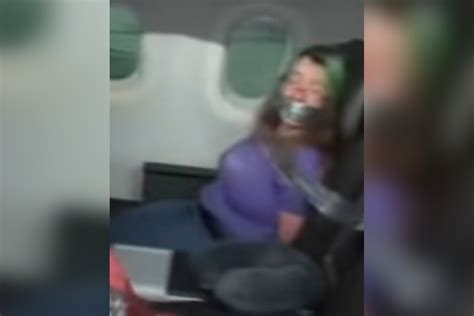 Video Shows Woman Duct Taped To Seat After Trying To Open Airplane Door