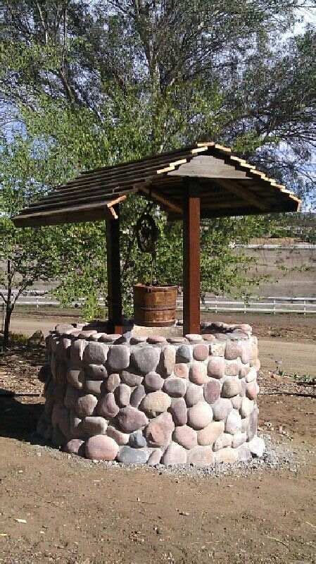A Do It Yourself Garden Stone Wishing Well Brings Many Decorative