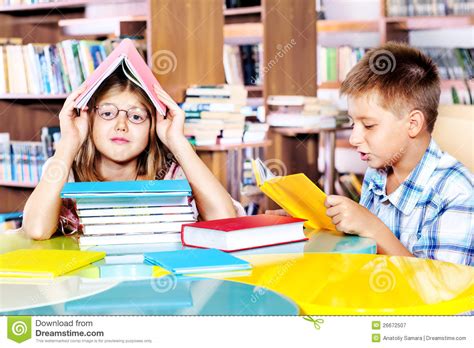 Girl And Boy In A Library Stock Image Image Of Interested