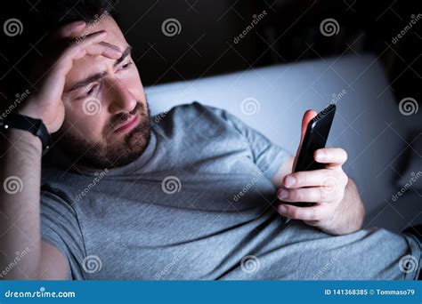 Man Feeling Depressed Using Phone At Night Stock Image Image Of