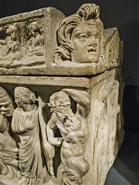 Large Satyr Head On The Right Corner Of A Small Roman Sarcophagus