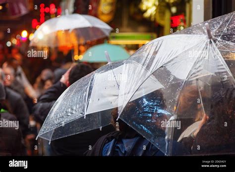 Women With Rain Umbrellas Shopping In The Rainy City Stock Photo Alamy