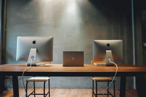 Two Silver Imac On Table · Free Stock Photo