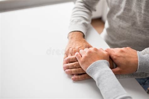 Close Up Of Young Woman Holding Senior Man Hands Stock Image Image Of
