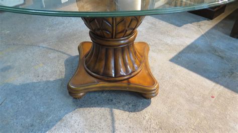 This piece is perfect to hold your things and you can add an umbrella to create a shady spot for meals with family and friends. Large Round Glass Table w/Carved Wooden Pedestal Base ...