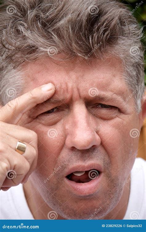 A Man Frowning Stock Photo Image Of Person Face Close 23829226