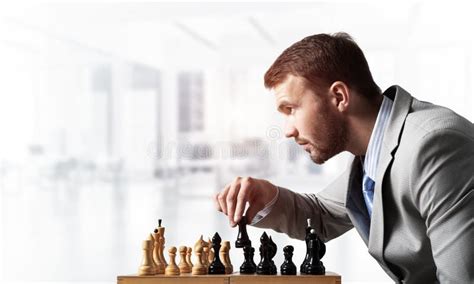 Concentrated Businessman Playing Chess Game Stock Photo Image Of