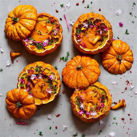 Small Pumpkins Are Arranged On A Table