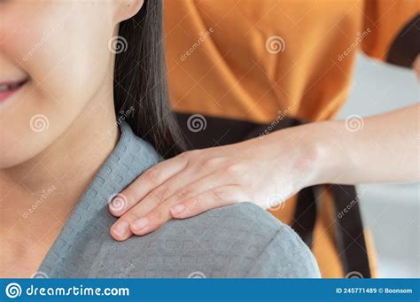 Masseur Hands Make Neck Massage For Beautiful Woman On Massage Table Stock Image Image Of