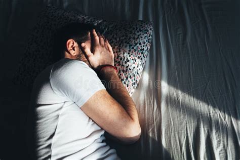 Young Depressed Man Crying In Bed Stock Photo Image Of Mental