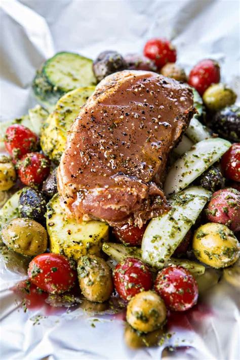 Tender pork loin is easy to prepare and absolutely delicious. Pesto Pork Chop and Summer Vegetable Foil Dinners | Pork chop recipes, Foil dinners, Pork chops