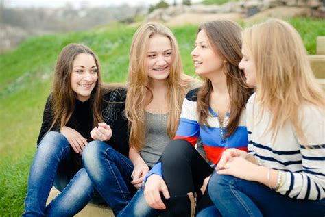 Four Happy Teen Girls Friends Having Fun Outdoors Stock Photo Image