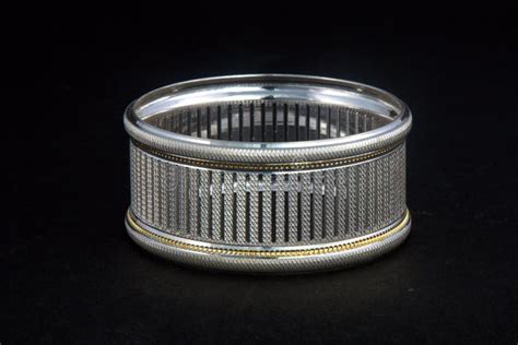 Silver Bangles And Gents Kade And X28 Hand Band And X29 Stock Photo