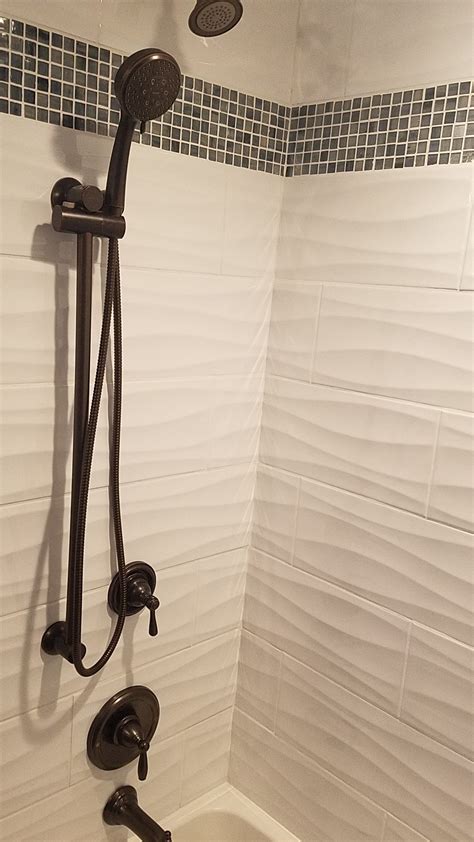 large wave subway tile in the shower area adds texture to the walls bathroom shower walls