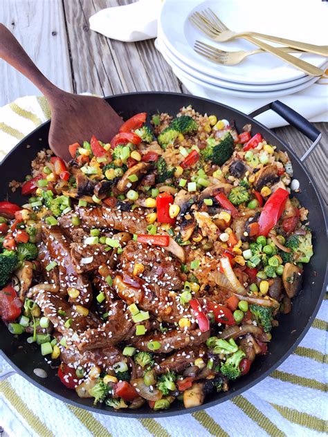 Let it sit for a few minutes, then fluff with a fork. One-Pan Cauliflower Fried Rice and Beef Stir Fry. - DomestikatedLife