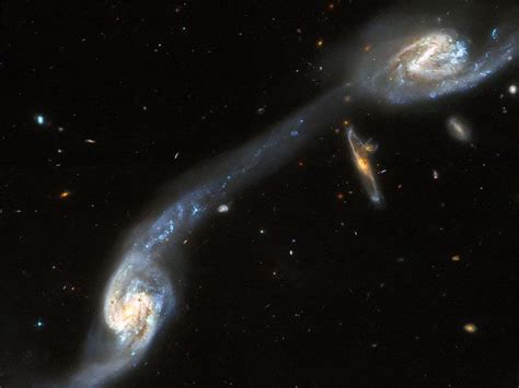 Hubble Space Telescope Captures Two Out Of Three Galaxies In Wilds