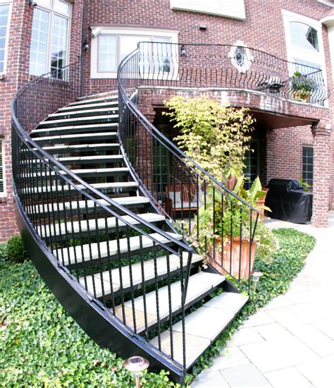 Curved Exterior Staircase With Wrought Iron Balcony Rail Traditional