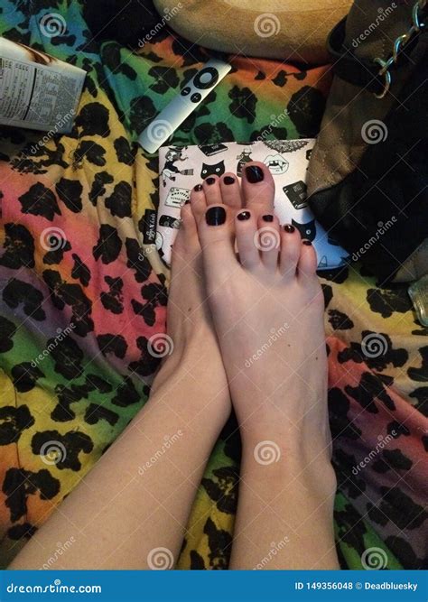 Close Up Female Pedicured Perfect Feet With Black Polish Softest