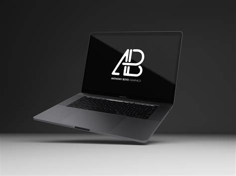 Download Floating black MacBook Pro Mockup | Mockup World