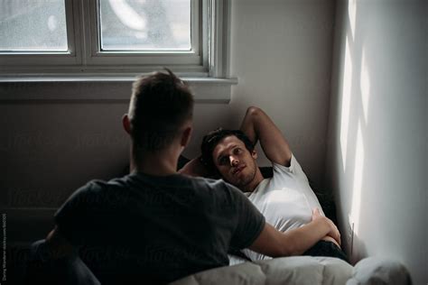 Young Gay Lovers In Morning Light Lying On Bed By Stocksy Contributor Jess Craven Stocksy