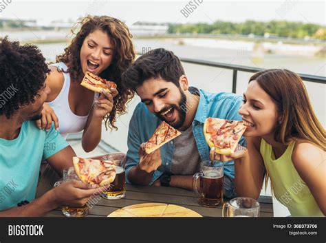Friends Enjoying Pizza Image And Photo Free Trial Bigstock