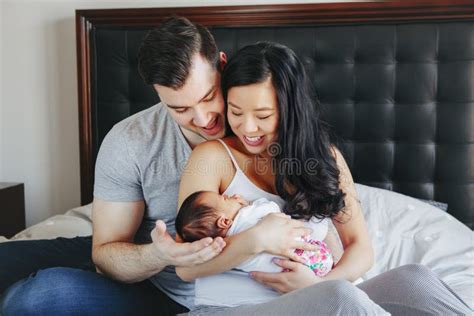 Chinese Asian Mother And Caucasian Father With Mixed Race Newborn