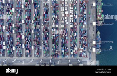 Mega Container Ship Docked At Hong Kong Port During Loading And