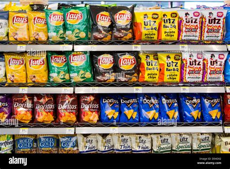 Lays Utz And Doritos Potato Chips On Display At A Walgreens Stock