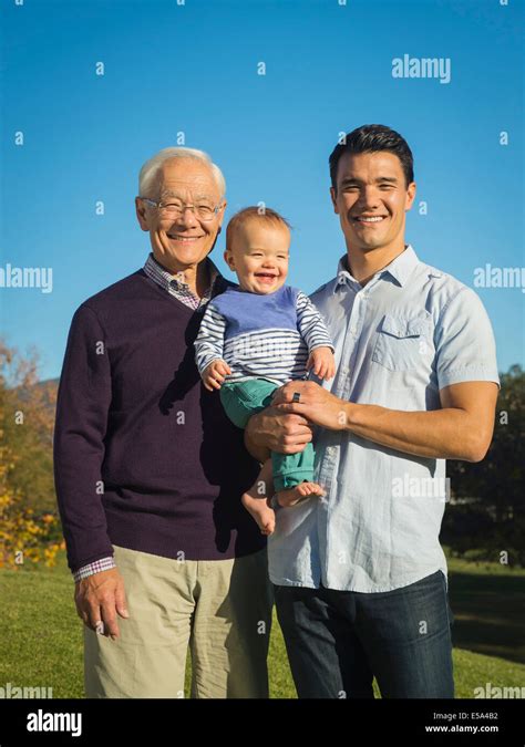 Three Generations Of Men Smiling Together Outdoors Stock Photo Alamy