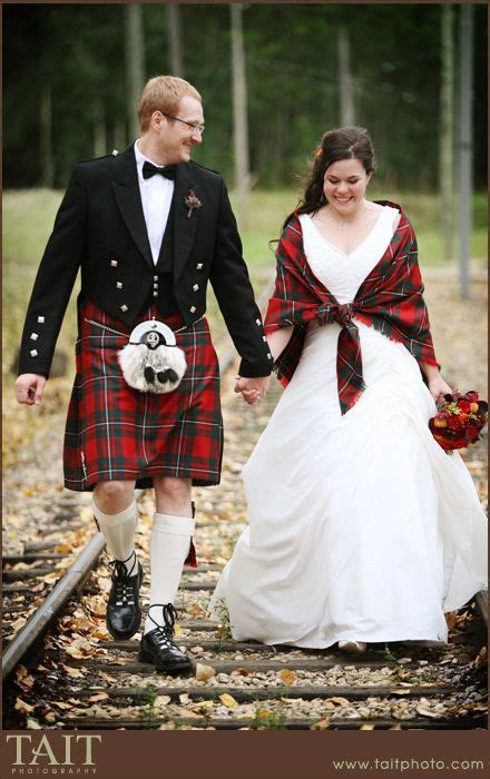 scottish wedding love the bride wrapped in a shawl made in the tartan of her groom