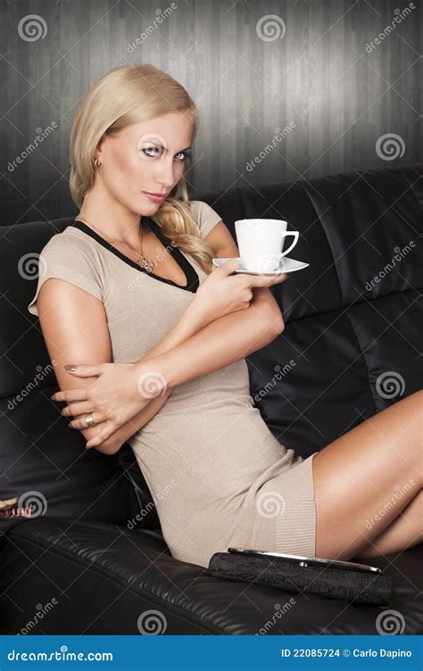 Sitting On Sofa Drinking From A Cup Stock Photo Image Of Caffeine