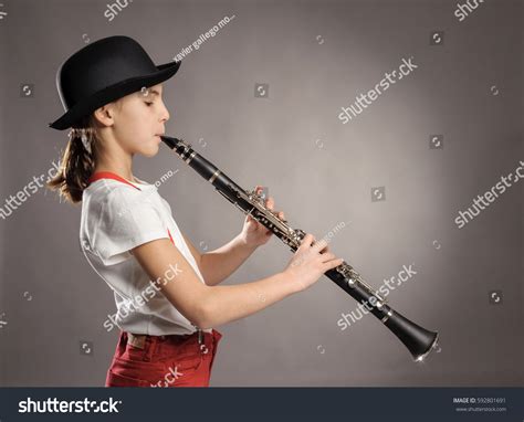 Little Girl Playing Clarinet On Gray Stock Photo 592801691 Shutterstock