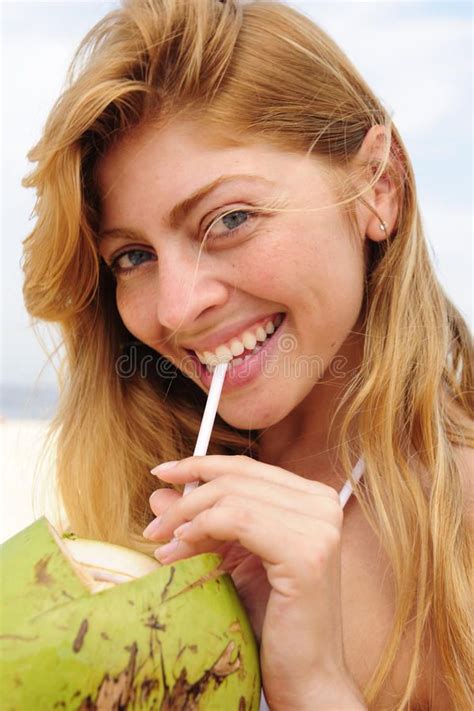 Thirsty Woman Drinking Coconut Water On The Beach Thirsty Blond Woman Drinking Affiliate