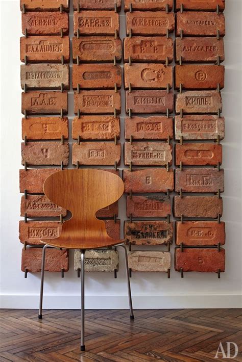 Create A Gallery Wall Using A Unique Collection Decor Brick Wall Brick