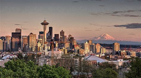 Seattle Skyline At Sunset With Mount Rainier In The Background By